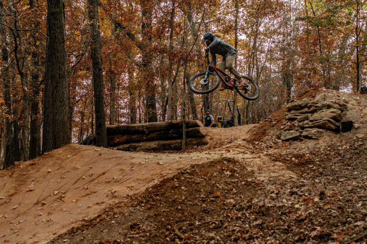 Rider jumping Progressive Trail Design trail in Bentonville Arkansas